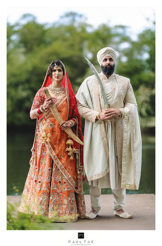 bride and groom by the lake