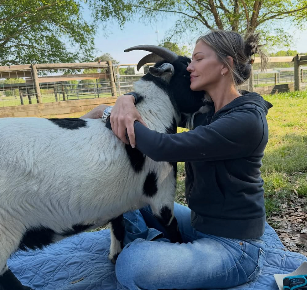 Photo of Tricia Helfer and Larry, the GOAT
