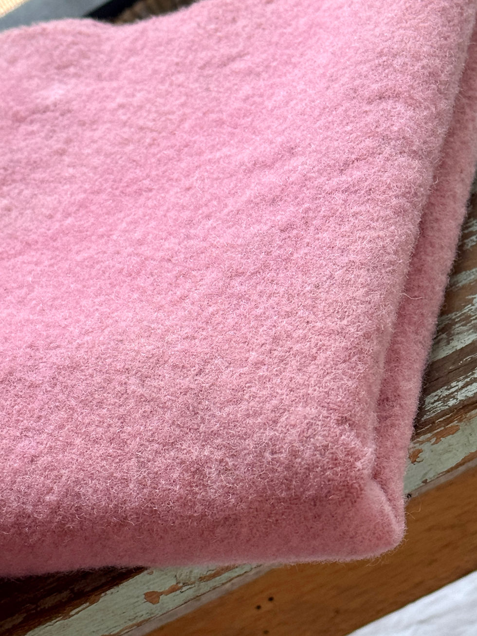 folded pink hand dyed wool fabric for rug hooking