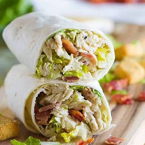 Grilled Chicken Ceasar Wrap- lettuce, tomato, shaved parmesan cheese, homemade caesar dressing wrapped in a toasted tortilla