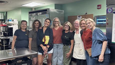 Eight Impact Austin women in the Trinity Center Austin kitchen
