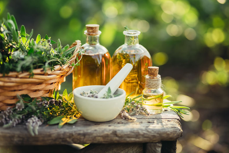 Spa composition with Fresh herbs and different types of oils. Selective focus..jpg
