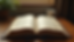 Eye-level view of an open Quran with Hindi translation on a wooden desk