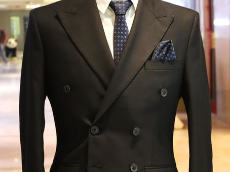 “The Timeless Appeal of the Black Double-Breasted Suit: Mastering Elegance and Authority in Modern Menswear”