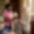 two women sorting clothes pink polo shirt.png