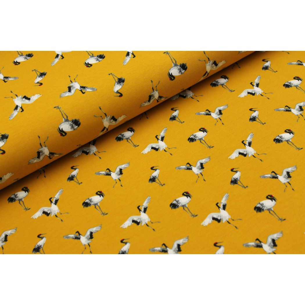 Okerkleurige jogging met kraanvogels - €14,5/m