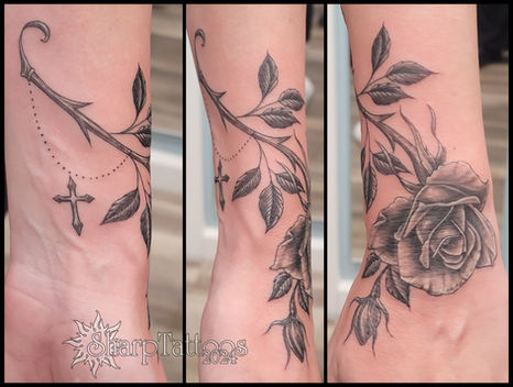 Black & grey rose tattoo around a wrist with cross, sharptattoos