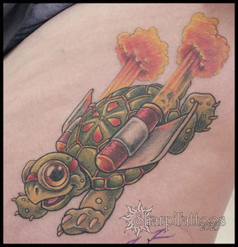 colorful tattoo of a tortoise wearing rocket boosters, flying through the air, sharptattoos