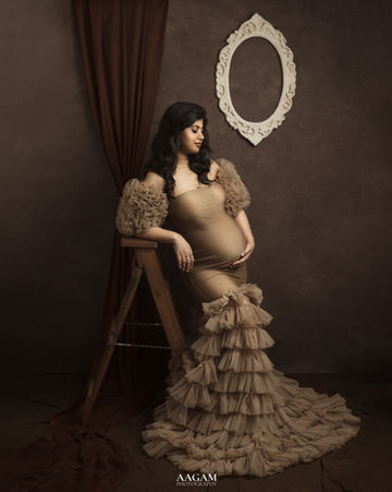 Romantic fine art maternity image with vintage-inspired styling