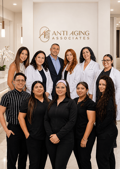 Anti Aging Associates team portrait in a bright Florida-style clinic with a white receptio