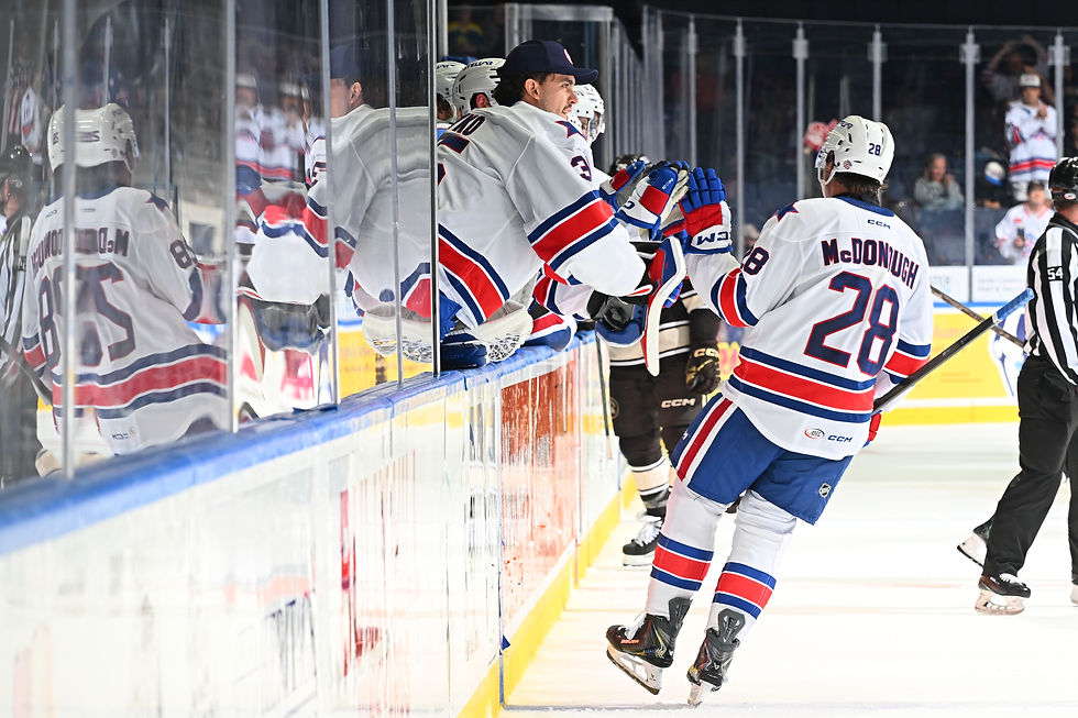 Amerks LW Aidan McDonough celebrating with the bench on Oct. 28, 2026. (Photo credit: Micheline Veluvolu / Rochester American