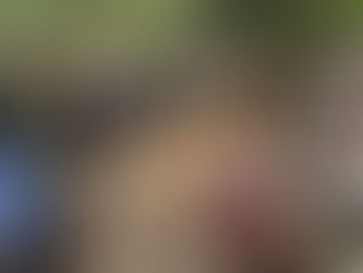 A group of educators sitting in a circle outside in nature to hold an open and honest conversation about their wellbeing