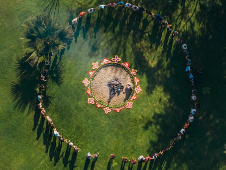 An aerial view of a circle of conscious leaders and educators gathered for a retreat in Bali