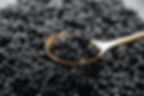 Metal spoon and black caviar closeup_edited.jpg