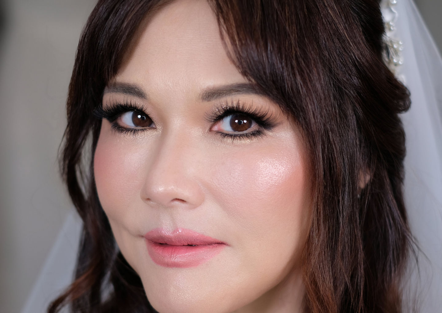 Portrait of East Asian bride showcasing luxury makeup by House of Howes Brides, Shropshire 