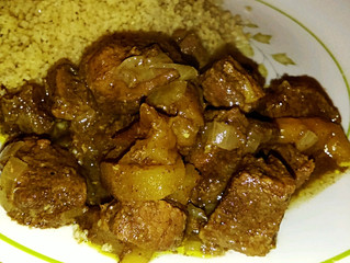 Tagine of goat with apricots, prunes, and honey
