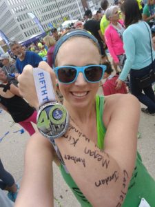 Sasha holding up a medal