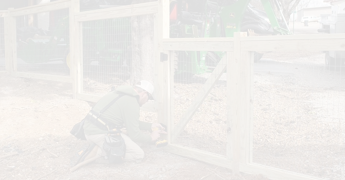 worker building a fence in Imboden, Arkansas