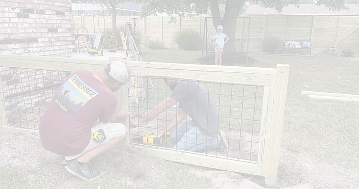 worker building a fence in Walnut Ridge, Arkansas
