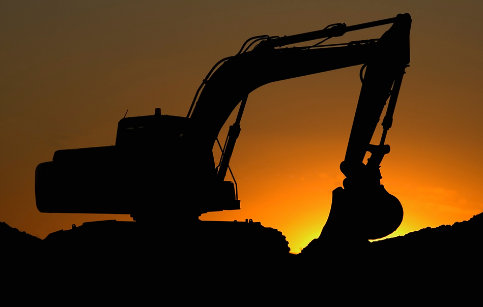 Excavator in front of a sunset