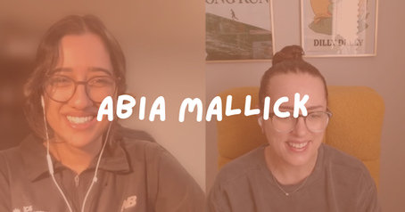 Split-screen of two smiling women on video call, one with earbuds and glasses, with ABIA MALLICK text over framed art and chair.