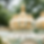 Golden domes with ornate details and soft green accents, set against a blurry green background, exuding an elegant and regal mood.