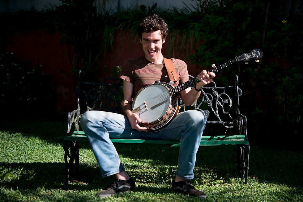 Julian Root poses with his banjo in La Antigua Guatemala. Photo: Comvite