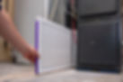 A person changing an clean air filter on a high efficiency furnace.jpg