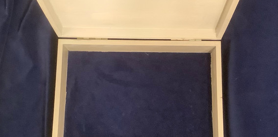 Box interior bottom lined with blue cotton velvet