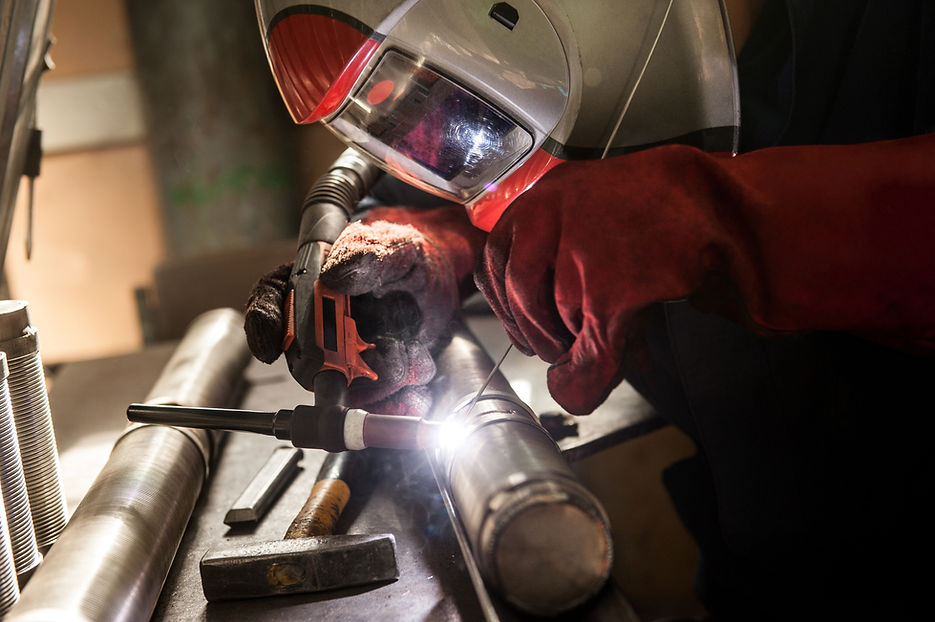 closeup-of-man-wearing-mask-welding-in-a-workshop-2024-05-30-07-41-37-utc.jpg
