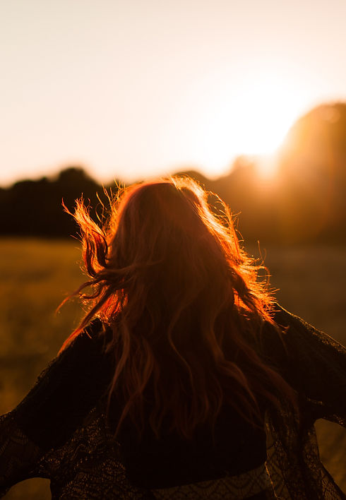 Girl Running in Field at Sunset_edited.jpg