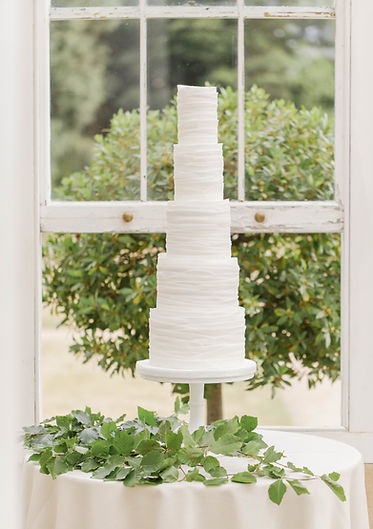 cobi and coco white wedding cake