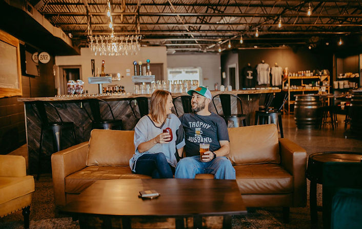 Couple on couch with drinks.JPEG