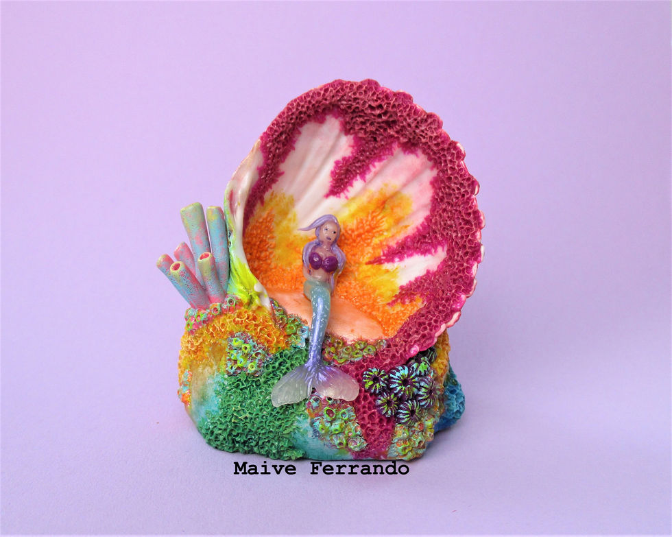 Mermaid sculpture in a real seashell