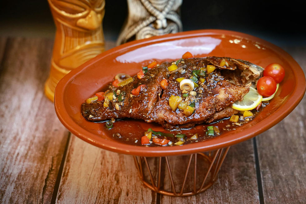 6 Healthy Clean Eating Seafood Recipes: Garlic-Infused Whole Fish with Veggies  