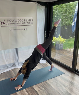 Woman performing Intermediate Pike exercise