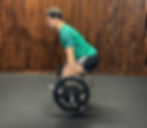 Runner completing a hex bar deadlift.