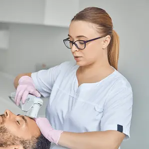 an esthetician performing a treatment on a client.