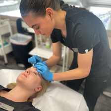 an esthetician waxing another student at the Euro Institute of Skin Care, Renton, WA