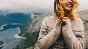A Scandinavian woman with fjord in the background