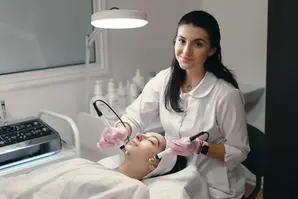 An esthetician performing a treatment.