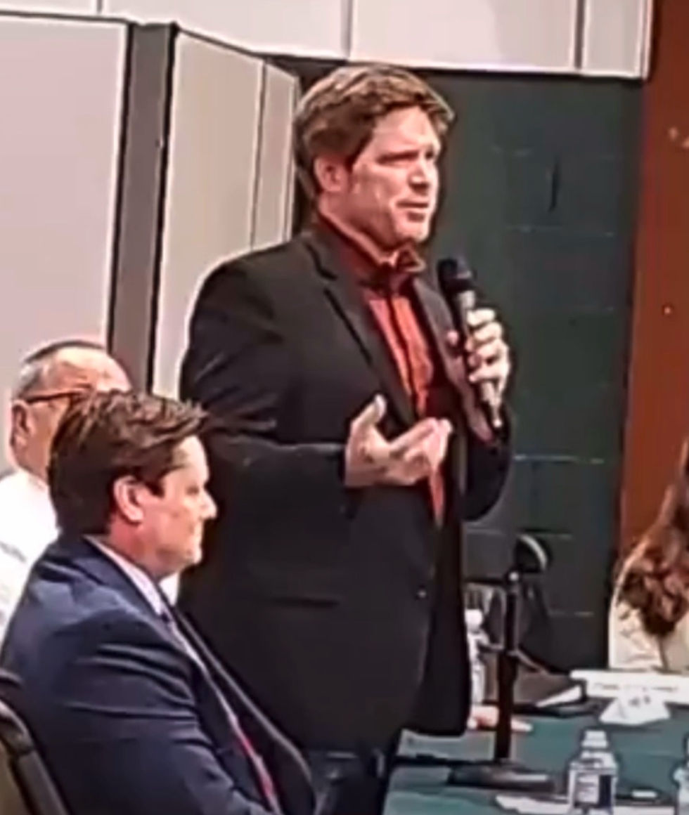 politician speaks at a debate