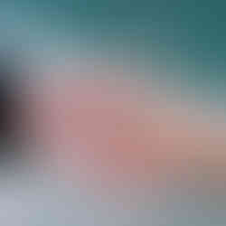 Bride and groom holding hands showing their wedding bands for a photo