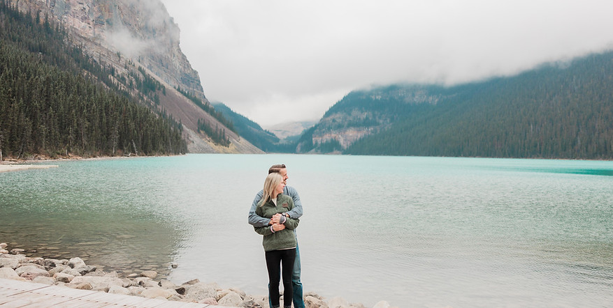 Lake Louise proposal photographer taking photos of the newly engaged couple