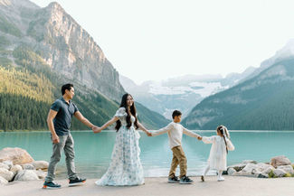 Family walking together during their family photo session at Lake Louise, Alberta