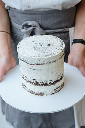 Icing a cake. Food photography by sussex lifestyle photographer Beth Steddon