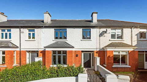 KBV Properties, High-Spec Renovation and Extension by Greenlight, Residential Development – Refurbished two-storey terraced home with red brick lower facade, white rendered upper facade, bay windows, and a landscaped front garden, transformed into a modern energy-efficient property.