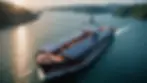 Eye-level view of a cargo ship equipped with solar panels