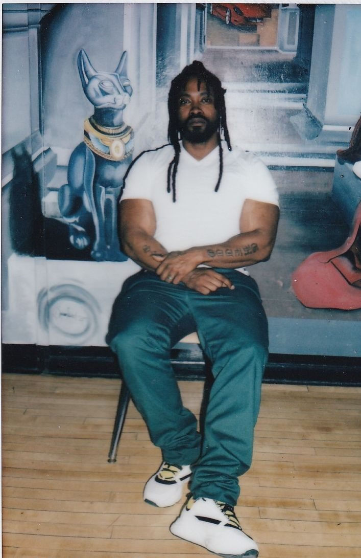 Kenny Bazile takes a picture in prison.