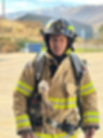 Brandon Woods in firefighter uniform